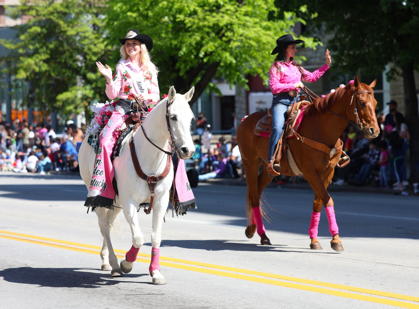 Two women ride horses at Pegasus Parade.JPG
